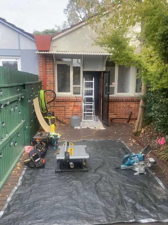 A NewLife job site set up with drop sheets, saws and tools