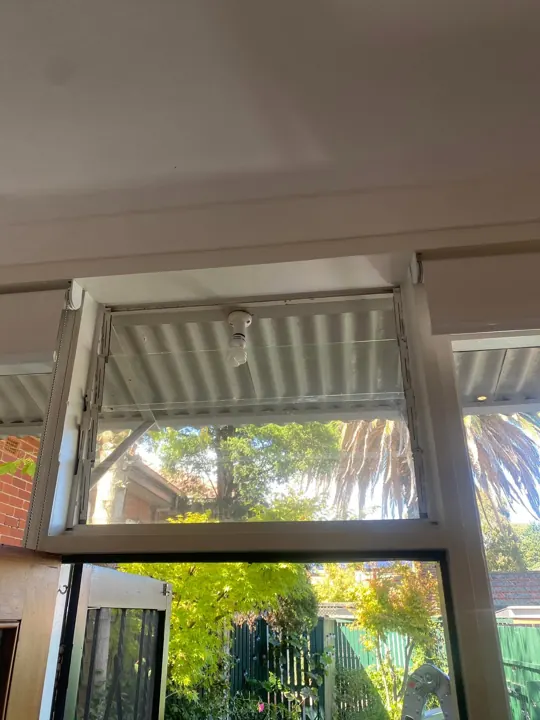 Converted fixed window looking out to the garden