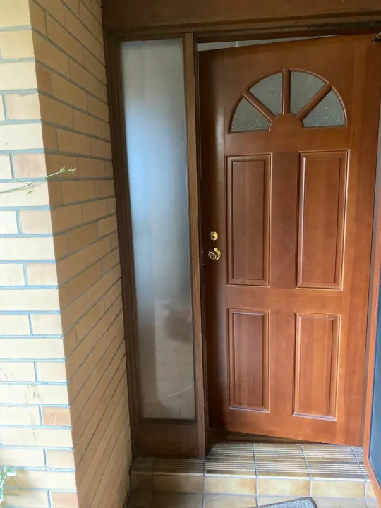 Timber front door with a frosted sidelight