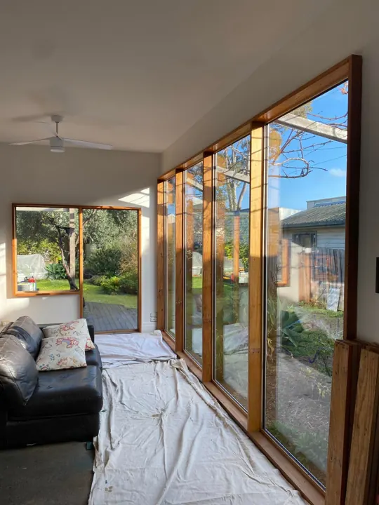 New full-height timber sliding doors seen from inside
