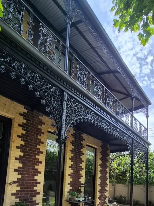 Two-storey Victorian terrace with iron lace balustrades